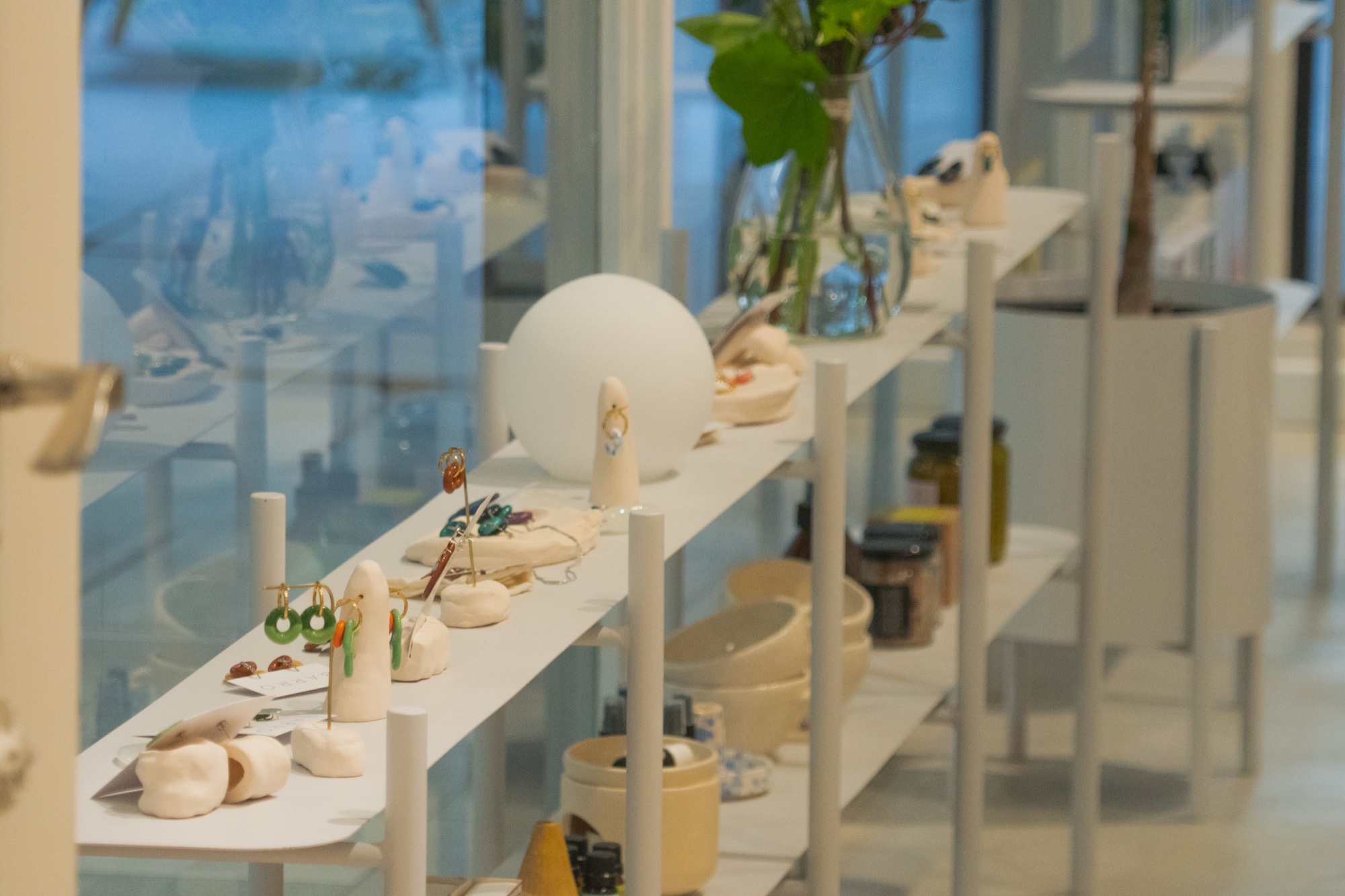 Suri store interior — shelves, ceramics, plants